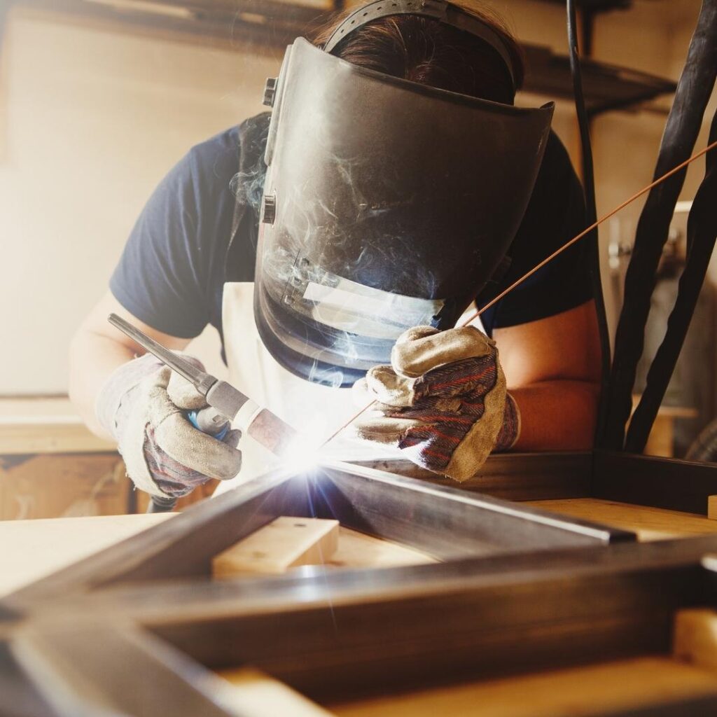 3 Wear Proper Safety Gear Person wearing safety gear while welding