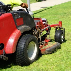 Person on a zero-turn riding mower