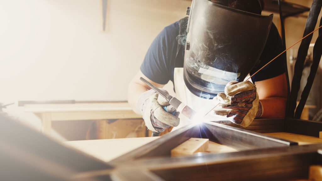 man welds